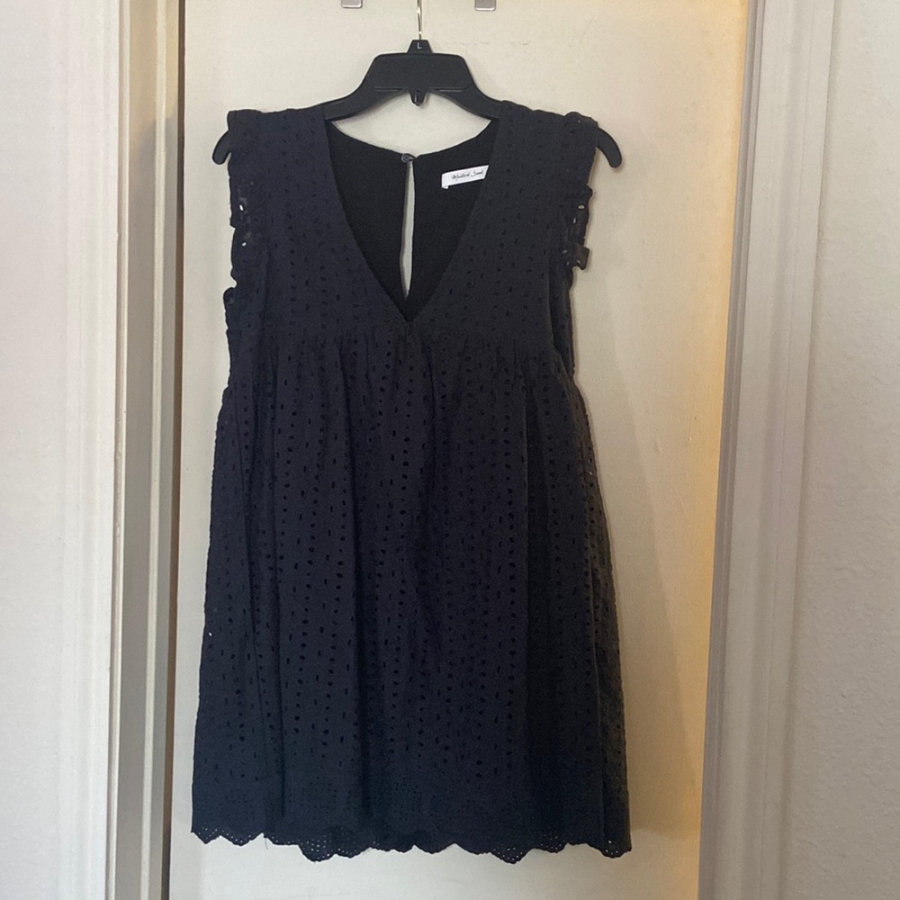 Black mini dress with eyelet detailing by Mustard seed.